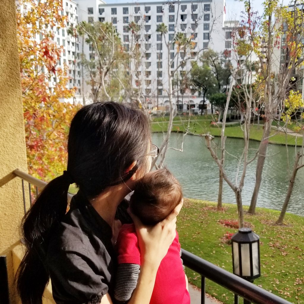 Travel blogger and baby at the Avenue of the Arts Costa Mesa hotel